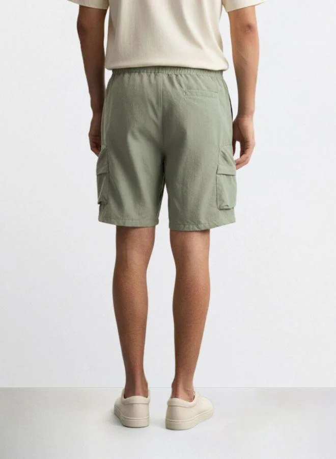 The Indian Garage Co Men Relaxed Fit Solid Cargo Pocket Mid-Rise Cargo Shorts